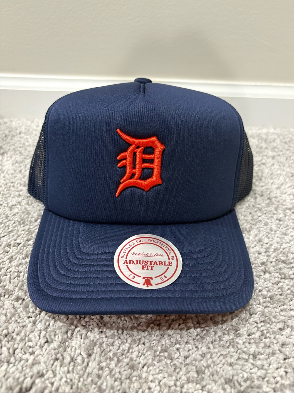 Mitchell & Ness Navy Blue Trucker Hat with Orange 'D' Logo